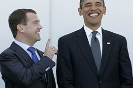 Russian President Dmitri Medvedev (L) shares a laugh with US President Barack Obama, L''Aquila, Italy