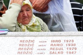 Relative of Srbrenica victim cries at grave