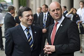 European Commission President Jose Manuel Barroso (L) is welcomed by Swedens Prime Minister Fredrik Reinfeldt