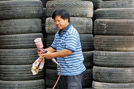 A man works at a tyre store in Beijing