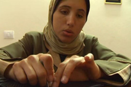Munzer's daughter is visually impaired and seeking treatment for her is difficult [Al Jazeera]