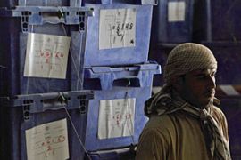 Afghans move boxes of ballot materials