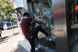 Istanbul, protesters smash the windows of a bank during an anti-International Monetary Fund (IMF) and World Bank protest