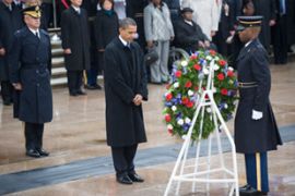 US President Barack Obama stands in silence after laying a wreath at the Tomb of The Unknowns veterans day arlington cemetery