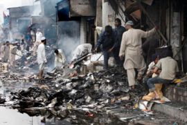 Shops destroyed in riots after Karachi bomb blast