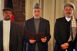 karzai swears in cabinet