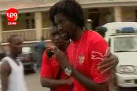 Emmanuel Adebayor - Togo footballer - comforted after shooting in Cabinda