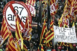 Thousands of people protest against plans of the Spanish government to raise the age for the state pension from 65 to 67 in Barcelona