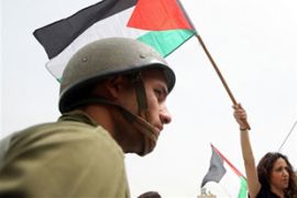 A protester waves a Palestinian flag