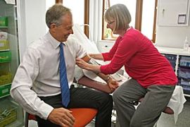 Former British Prime Minister Tony Blair, has his blood pressure taken by nurse Paula Martin during an Labour Party election campaign visit to the Alexandra Avenue Health and Social Care Centre in north London