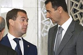 Russian President Dmitry Medvedev (L)and Syrian President Bashar Assad