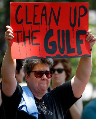 A demonstrator holds a placard during a rally in New Orleans