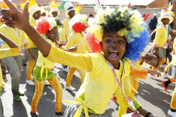 Performers dance during a carnival parade to bid farewell to 2010 World Cup