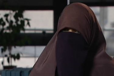 Woman wearing face veil