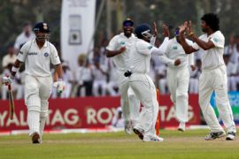 India player walks off the field as Sri Lanka''s players celebrate during 1st test match