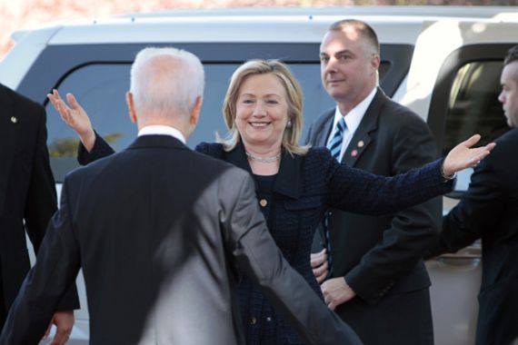 U.S. Secretary of State Clinton greets Israel's President Peres