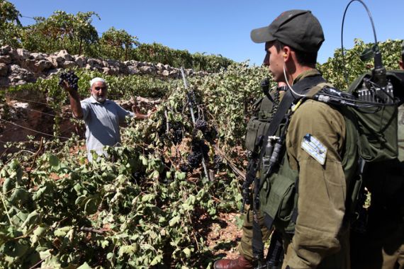 Israeli soldiers and Palistinian farmer