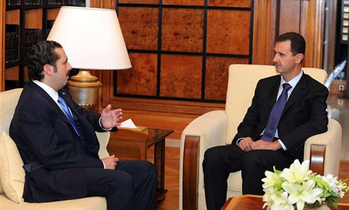 Bashar al-Assad (R) meeting with Lebanese Prime Minister Saad Hariri