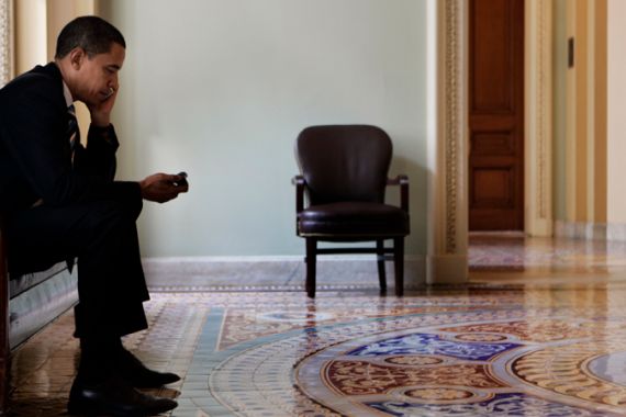 Barack looking at mobile