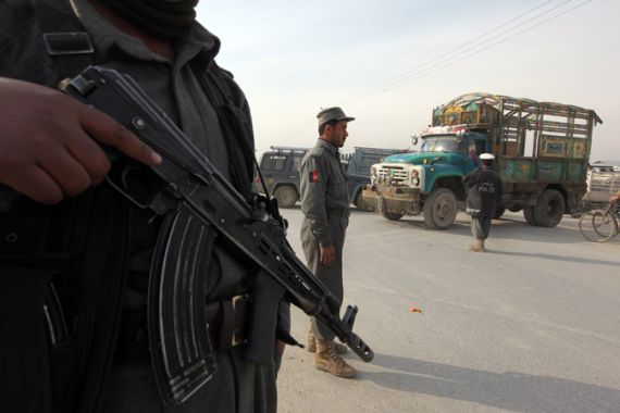 Afghan troops guard checkpoint