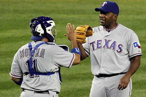 Texas Rangers celebrate after they won 10-3 against the New York Yankees in Game Four