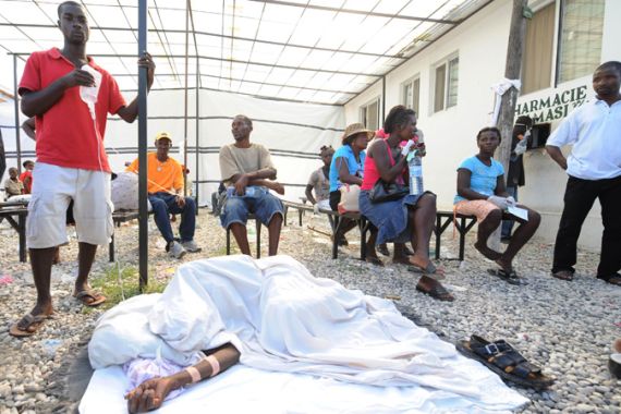 Families wait for cholera care in Haiti