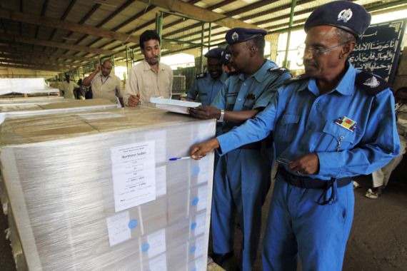 Customs officers check voter registration books