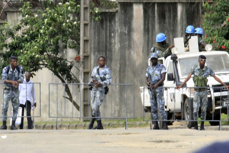 Security forces are seen deployed around the election commission''s office in Abidjan