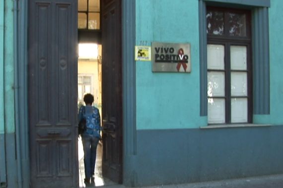 HIV-positive woman in Chile walking into clinic