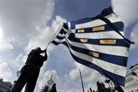 Greece budge protests (it says "for sale" on the flag)