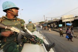U.N. soldiers patrol along a street in the Attiecoube area of Abidjan