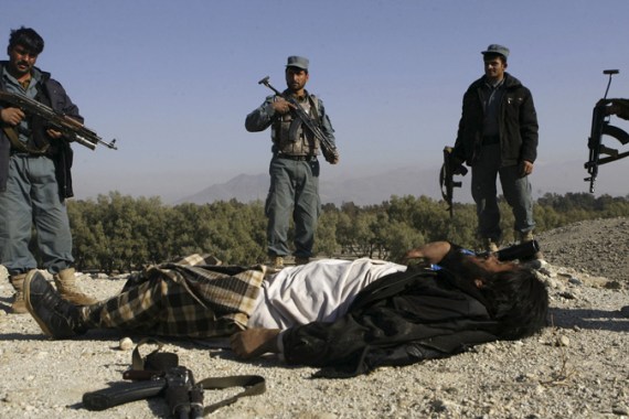 Afghan police and dead Taliban