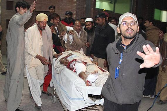An injured man is rushed to a hospital after a suicide bomb attack, targeting the mourning procession of Shi''ite Muslims marking the Chehlum of Imam Hussein (the end of Ashura mourning), is rushed to in Lahore, Pakistan, 25 January 2011