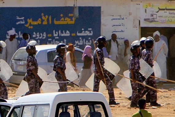 Sudanese riot police hold their shields and sticks as students clashed with police heeding calls to take to the streets for a day of nationwide, anti-government protests despite a heavy security deployment in the capital Khartoum, on January 30, 2011