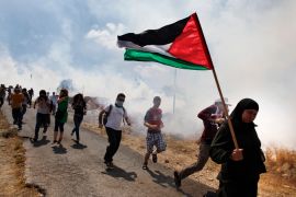 Israeli troops confront peaceful West Bank protest with tear gas