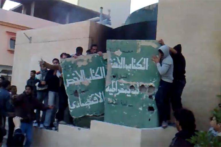 Libyan protesters tear down Muammar Gaddafi''s "Green Book"
