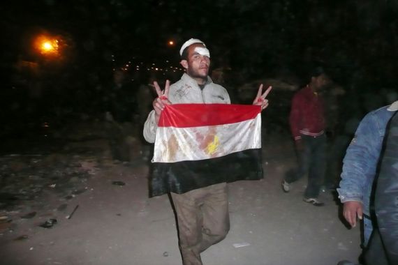 Battle of Tahrir Square - Egyptian holding a flag