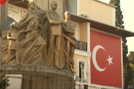 Turkish flag flies above statues in Istanbul