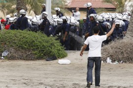 Protester faces police in Bahrain