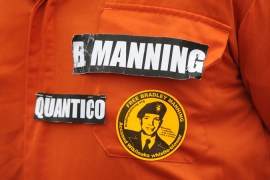 Protester wears Guantanamo-style orange jumpsuit in support of Bradley Manning