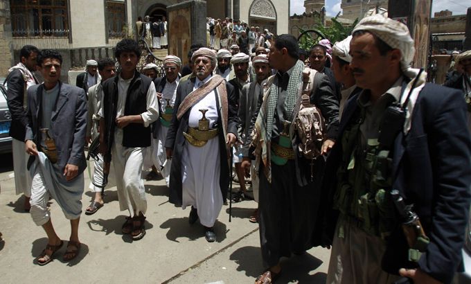 Tribal leader Sheikh Sadiq al-Ahmar (C) is surrounded by bodyguards