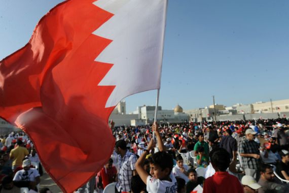 Bahrain protest - boy waving flag