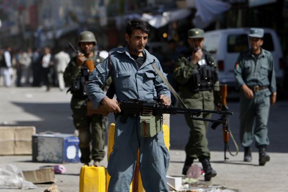 Afghan police officer with big gun