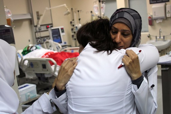 Doctors embrace at Salmaniya Medical Complex in Bahrain