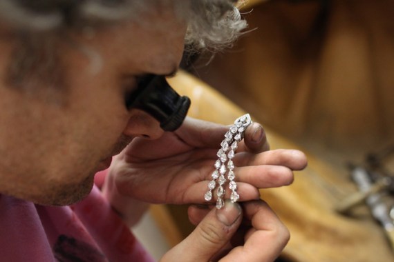 Jeweller examining earring
