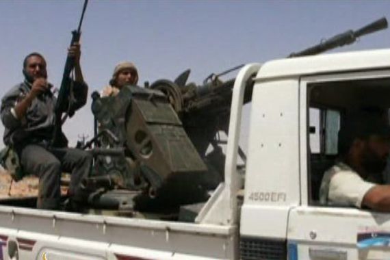 Libyan rebels with machine gun on truck