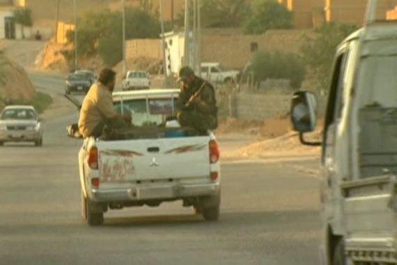 Rebels ride in a truck in western mountains of Libya