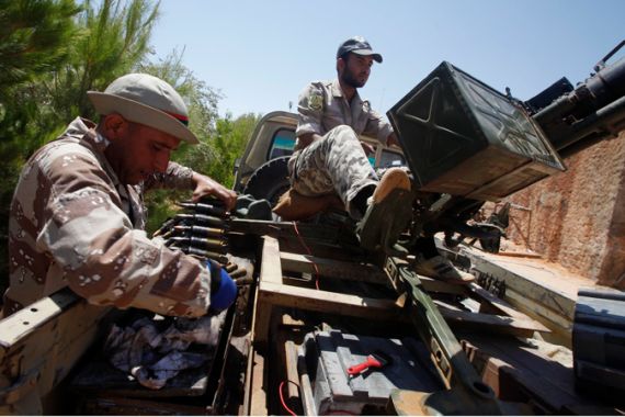 Libya rebels with pick-up-mounted guns and ammunition