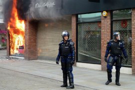 uk riots fire police