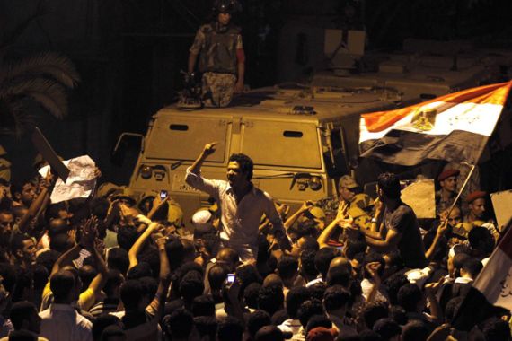 Egyptian protesters shout slogans in front of the Israeli embassy in Cairo